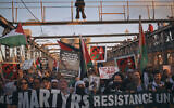Palestinian supporters shout slogans as they cross the Brooklyn Bridge during a demonstration demanding a ceasefire in the Israel-Hamas war, praising Palestinian "resistance" and denouncing Israel, October 28, 2023, in New York. (AP Photo/Andres Kudacki)