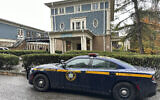 A New York State Police Department cruiser is parked in front of Cornell University's Center for Jewish Living, in Ithaca, New York, October 30, 2023. (AP Photo/David Bauder)
