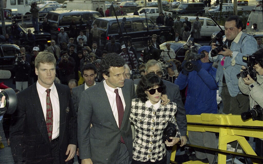 Financier Michael Milken, with his wife Lori, arrives for sentencing at the US District Court, in New York, November 21, 1990. (AP Photo/Richard Drew)