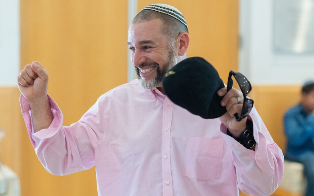 Richard Cortes cheers after his Mikveh at Congregation Beth Israel on August 17, 2023 in Paradise Valley, Ariz. The formerly Messianic congregation led by Cortes converted to Judaism at Beth Israel. (Caitlin O’Hara via JTA)