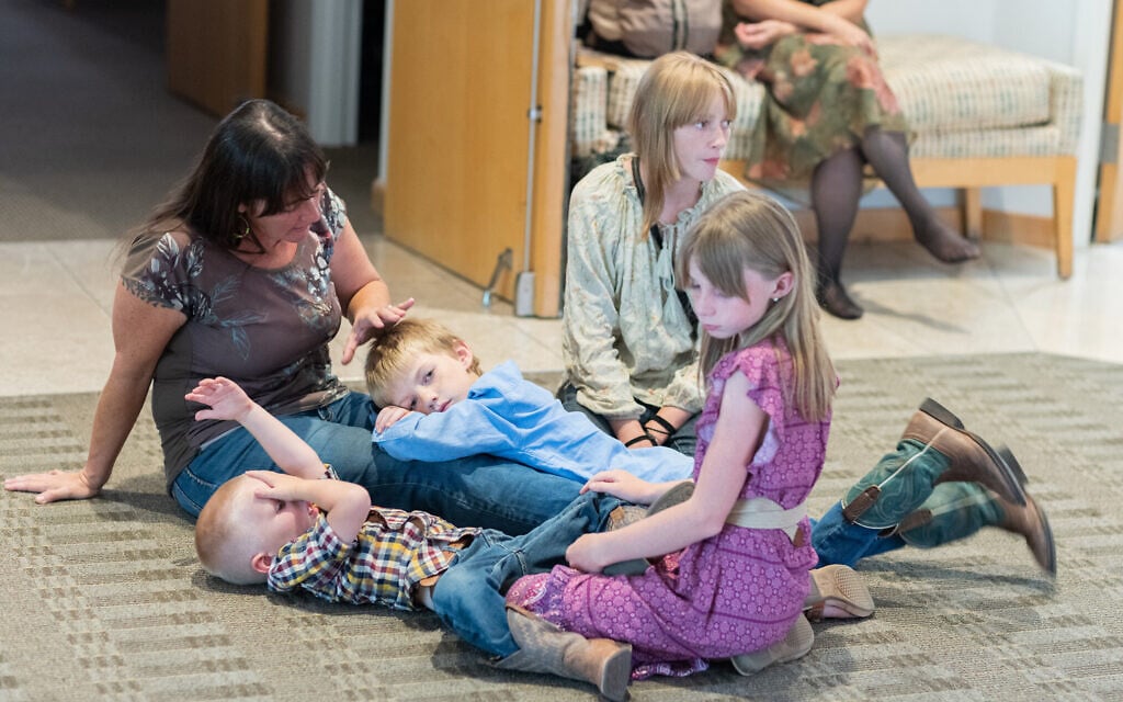 Stefani Most with her sons, Jubal, 3, and Joel Israel, 7, center, and daughters Merily, 13, and Fiona, 10, at Congregation Beth Israel on August 17, 2023, in Paradise Valley, Arizona. (Caitlin O’Hara via JTA)