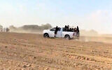Cars and partygoers fleeing the site of the Kibbutz Re'im Nature Party on October 7, 2023. (courtesy Shye Weinstein)