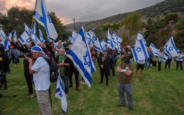 Anti-overhaul activists demonstrate outside the hotel in Neve Ativ where Prime Minister Benjamin Netanyahu and his wife Sara are vacationing, in the Golan Heights, October 2, 2023. (Ayal Margolin/Flash90) Anti-overhaul activists demonstrate outside the hotel in Neve Ativ where Prime Minister Benjamin Netanyahu and his wife Sara are vacationing, in the Golan Heights, October 2, 2023. (Ayal Margolin/Flash90)
