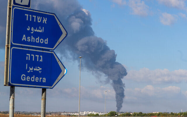 Smoke rises after a rocket fired from the Gaza Strip hits southern Israel, October 7, 2023 (Jamal Awad/Flash90) Smoke rises after a rocket fired from the Gaza Strip hits southern Israel, October 7, 2023 (Jamal Awad/Flash90)