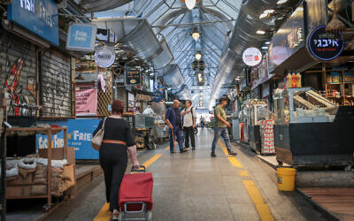 The empty Mahane Yehuda market in Jerusalem, at a time of heavy fighting between Israel and Hamas in Gaza, on October 8, 2023. (Noam Revkin Fenton/ Flash90)