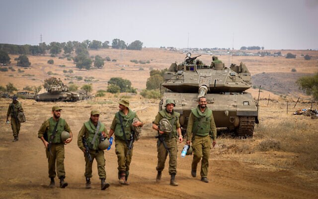 IDF soldiers at a staging area near the border with Lebanon, northern Israel, October 9, 2023. (David Cohen/Flash90) IDF soldiers at a staging area near the border with Lebanon, northern Israel, October 9, 2023. (David Cohen/Flash90)