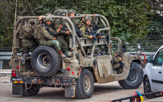 Israeli soldiers patrol on a road near the Gaza border, October 9, 2023 (Yossi Aloni/Flash90)