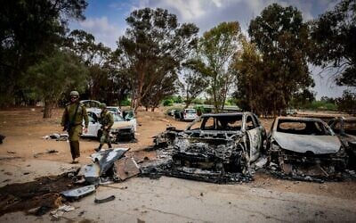 Burned and abandoned cars in the area of ​​the party where hundreds of Israelis were killed by Hamas terrorists who infiltrated Israel near the Gaza border, October 10, 2023. (Chaim Goldberg/ Flash90)