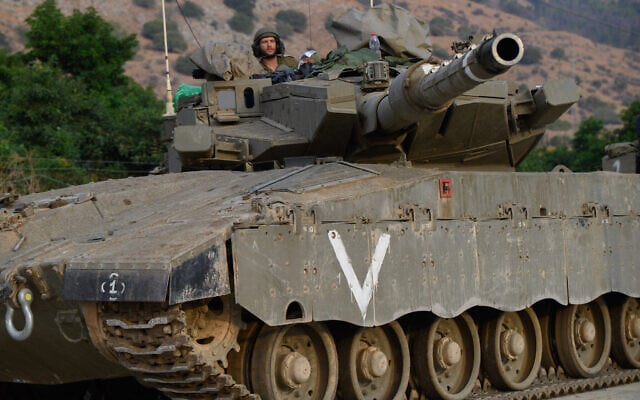 IDF armored forces at a staging area in Upper Galilee, near the northern Israeli border with Lebanon, October 11, 2023. (Ayal Margolin/Flash90) IDF armored forces at a staging area in Upper Galilee, near the northern Israeli border with Lebanon, October 11, 2023. (Ayal Margolin/Flash90)