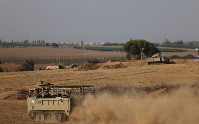 Israeli soldiers seen at a staging area near the southern Israeli border with Gaza, October 12, 2023. (Chaim Goldberg/Flash90) Israeli soldiers seen at a staging area near the southern Israeli border with Gaza, October 12, 2023. (Chaim Goldberg/Flash90)