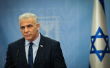 Opposition Leader Yair Lapid speaks during a faction meeting at the Knesset, in Jerusalem, on October 12, 2023. (Noam Revkin Fenton/Flash90)