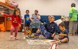 Children shelter inside a public bomb shelter in Ashkelon, October 12, 2023. (Yossi Aloni/Flash90)
