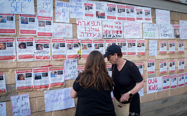 Families of Israelis held hostage by Hamas terrorists in Gaza since the group's murderous infiltration of Israel on October 7, 2023, protest outside the Ministry of Defense in Tel Aviv. October 14, 2023. (Tomer Neuberg/FLASH90) Families of Israelis held hostage by Hamas terrorists in Gaza since the group's murderous infiltration of Israel on October 7, 2023, protest outside the Ministry of Defense in Tel Aviv. October 14, 2023. (Tomer Neuberg/FLASH90)