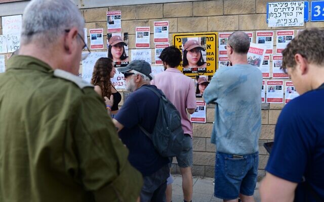 Families of Israelis held hostage by Hamas terrorists in Gaza protest outside the Ministry of Defense in Tel Aviv, October 14, 2023. (Tomer Neuberg/FLASH90)