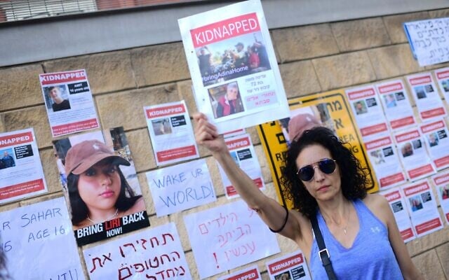 Families of Israelis held hostage by Hamas terrorists in Gaza protest outside the Defense Ministry in Tel Aviv, October 14, 2023. (Tomer Neuberg/FLASH90)