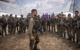 Israeli soldiers at a staging area not far from the Israeli-Gaza border, October 19, 2023. (Chaim Goldberg/Flash90)