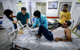 Wounded Palestinians are treated at Al-Najjar Hospital following an Israeli airstrike in the city of Rafah in the southern Gaza Strip, October 19, 2023, (Abed Rahim Khatib/Flash90)