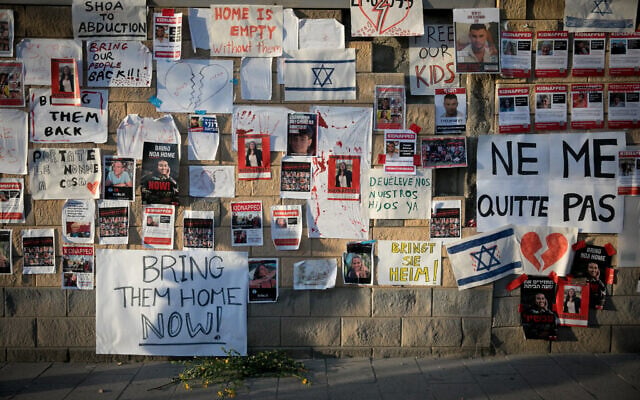 Posters calling for the release of hostages held by Hamas terrorists in Gaza, outside the Defense Ministry in Tel Aviv, October 21, 2023. (Miriam Alster/Flash90) Posters calling for the release of hostages held by Hamas terrorists in Gaza, outside the Defense Ministry in Tel Aviv, October 21, 2023. (Miriam Alster/Flash90)