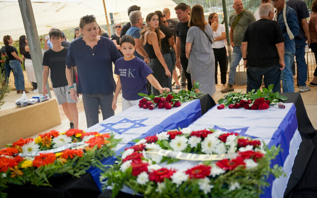Family and friends attend the funeral of Lili and Ram Itamari who were murdered by Hamas terrorists in Kibbutz Kfar Aza on October 7, 2023, in Kibbutz Ruhama, October 29, 2023. (Erik Marmor/Flash90) Family and friends attend the funeral of Lili and Ram Itamari who were murdered by Hamas terrorists in Kibbutz Kfar Aza on October 7, 2023, in Kibbutz Ruhama, October 29, 2023. (Erik Marmor/Flash90)