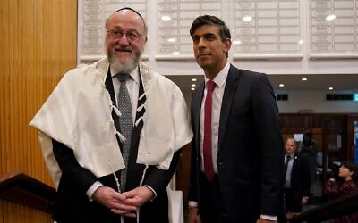 UK Chief Rabbi Sir Ephraim Mirvis (left) and Prime Minister Rishi Sunak attend a ceremony at the Finchley United Synagogue in central London for victims and hostages of Hamas attacks in Israel, October 9, 2023. (Lucy North/PA Images via Getty Images, via JTA)