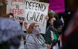 Illustrative: Students from Hunter College in New York City chant and hold up signs during an anti-Israel demonstration at the entrance of their campus on October 12, 2023. (Michael Nigro/Pacific Press/LightRocket via Getty Images, via JTA)