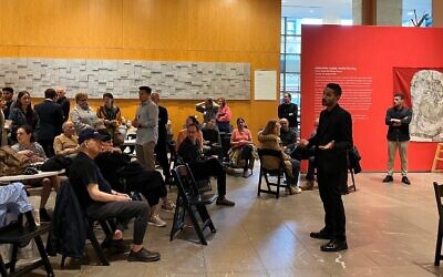 Acting Israeli Consul General Tsach Saar speaks to a crowd in the lobby of the Marlene Meyerson JCC Manhattan, who gathered in solidarity on a day when Hamas launched a deadly attack inside Israel, October 7, 2023.. (Julia Gergely via JTA)