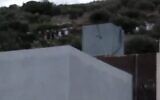 Screen capture from video of Israeli kibbutz resident leaving the West Bank Palestinian village of Jalbun, October 1, 2023. (X: Used in accordance with Clause 27a of the Copyright Law)