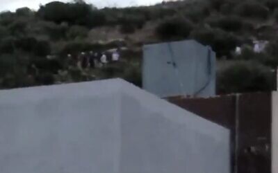 Screen capture from video of Israeli kibbutz resident leaving the West Bank Palestinian village of Jalbun, October 1, 2023. (X: Used in accordance with Clause 27a of the Copyright Law)