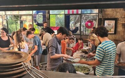 Making food for soldiers, southern evacuees and anyone who needs it at Ofaimme in Jerusalem, October 10, 2023 (Courtesy Offaime)