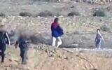 A video showing Avital Aladjem, a Kibbutz Holit resident, apparently being released along with two children by Hamas terrorists on the Gaza border, October 7, 2023. (X video screenshot: used in accordance with Clause 27a of the Copyright Law)