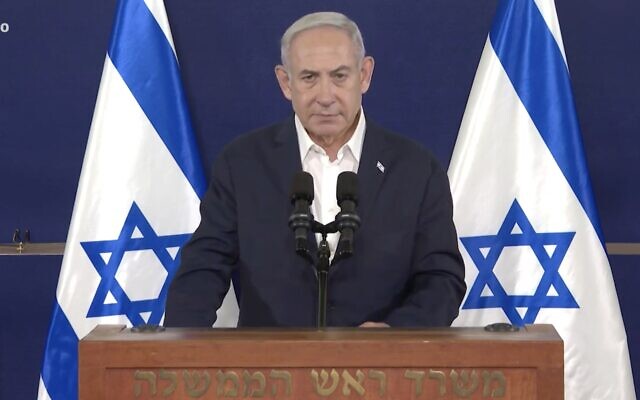 Prime Minister Benjamin Netanyahu speaks to the public from the IDF's Kirya military headquarters in Tel Aviv on October 18, 2023. (Screen capture/GPO) Prime Minister Benjamin Netanyahu speaks to the public from the IDF's Kirya military headquarters in Tel Aviv on October 18, 2023. (Screen capture/GPO)