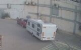 A suspect is seen stealing a trailer from the scene of the Re'im music festival massacre in security footage released by police on October 22, 2023  (Screen capture/Israel Police)