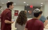 Jewish students in a library at Cooper Union college in New York as demonstrators outside pound on the doors and chant 'Free Palestine,' October 26, 2023. (X sreenshot; used in accordance with Clause 27a of the Copyright Law)