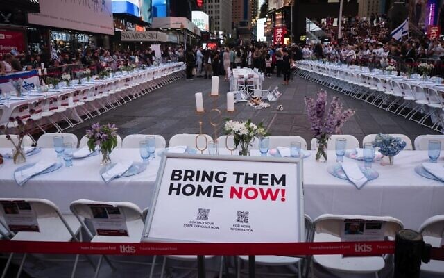 An empty shabbat table symbolizing the over 200 hostages held by Hamas in Gaza, in Times Square, New York City, October 27, 2023. (Luke Tress via JTA) An empty shabbat table symbolizing the over 200 hostages held by Hamas in Gaza, in Times Square, New York City, October 27, 2023. (Luke Tress via JTA)