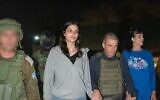 Natalie Raanan, 2nd left, Judith Raanan, right, are seen upon arrival in Israel after being released from Hamas captivity as government hostage envoy Gal Hirsch, center, holds their hands, October 20, 2023. (Courtesy)