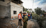 The scene where a rocket fired from the Gaza Strip landed and caused damage in the Arab village of Abu Ghosh, outside Jerusalem, October 9, 2023. (Jamal Awad/ Flash90)