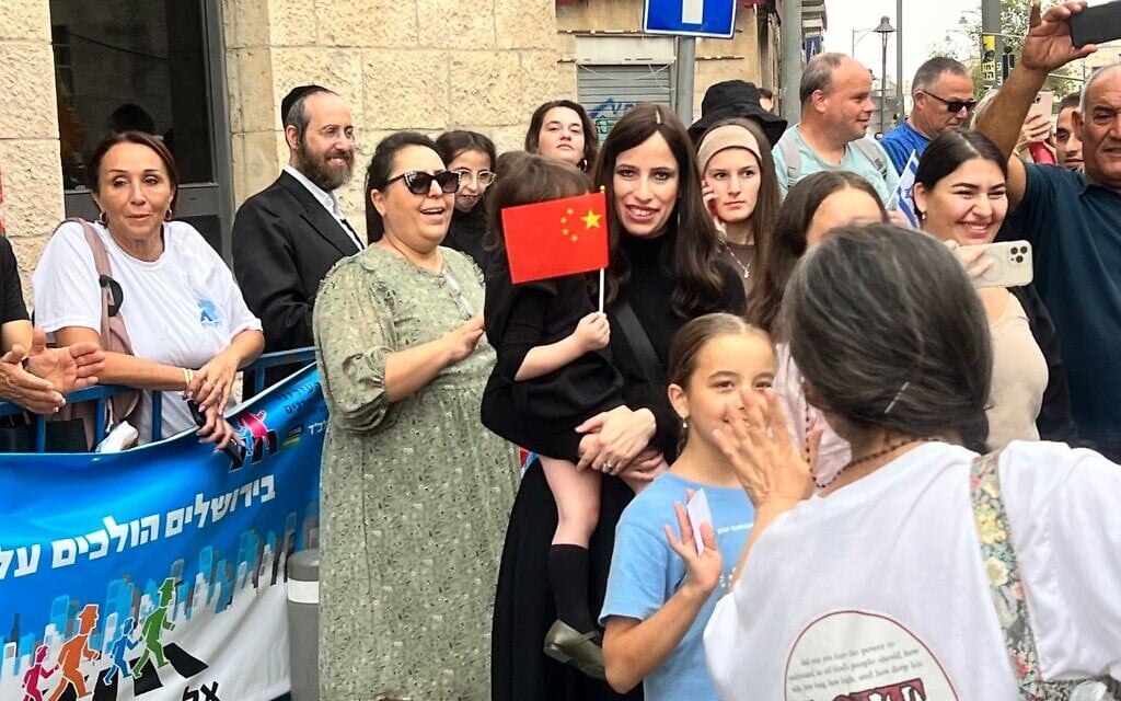 Israelis watch the International Christian Embassy of Jerusalem march, October 4, 2023 (Lazar Berman/The Times of Israel)