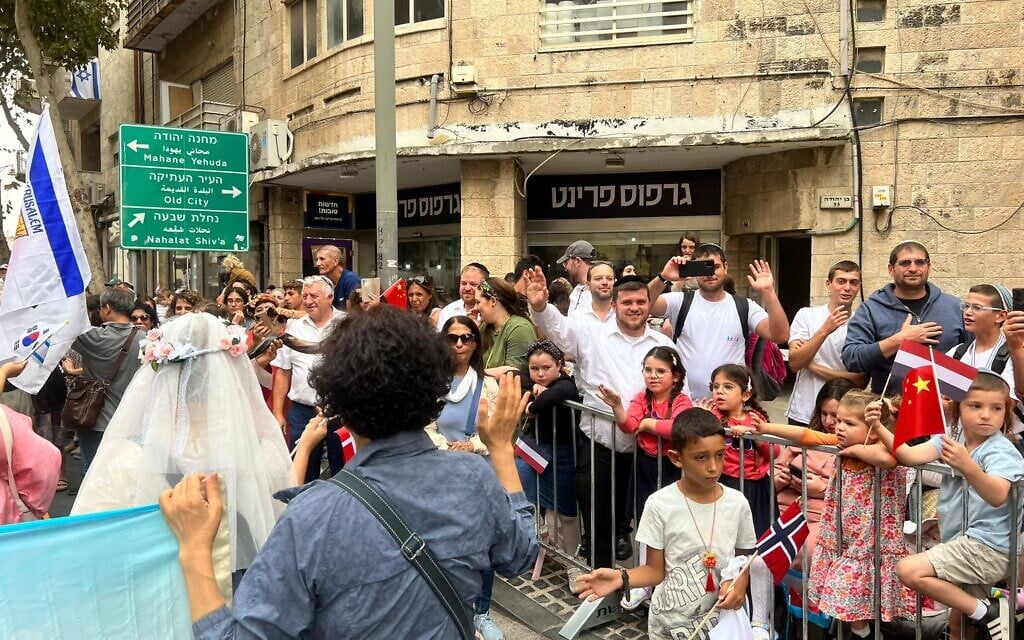 Israelis watch the International Christian Embassy of Jerusalem march, October 4, 2023 (Lazar Berman/The Times of Israel)