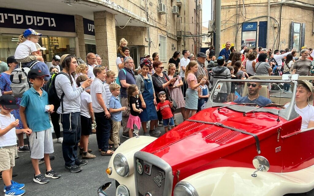 Israelis watch the International Christian Embassy of Jerusalem march, October 4, 2023 (Lazar Berman/The Times of Israel)