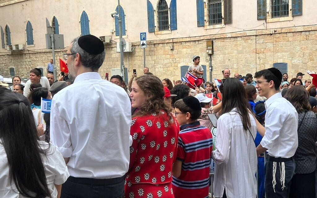 Israelis watch the International Christian Embassy of Jerusalem march, October 4, 2023 (Lazar Berman/The Times of Israel)