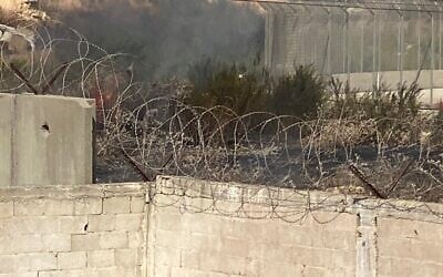 Damage is seen caused to the West Bank security barrier near the Nitsanei HaShalom Industrial Zone, October 13, 2023. (Israel Police)