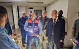 State Comptroller Matanyahu Englman, right, and Ma’alot-Tarshiha Mayor Arkady Pomeranets touring a bomb shelter in the city, October 17, 2023. (State Comptroller’s Office)