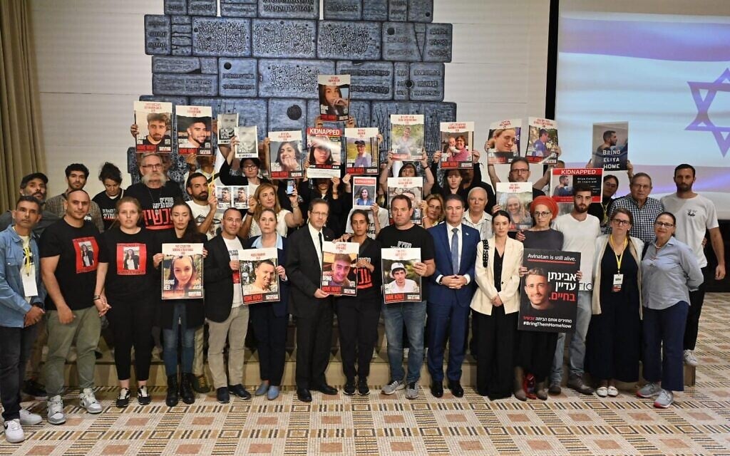 President Isaac Herzog meets in Jerusalem with families whose loved ones are believed to be held hostage in Gaza, October 22, 2023. (Kobi Gideon/ GPO)