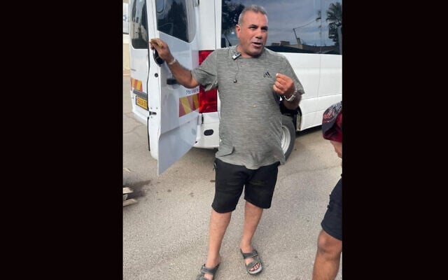 Youssef Ziyadne, an Arab Bedouin from the Israeli city of Rahat, shows off his minibus in which he reportedly saved 30 attendees of the Nova dance party after it was attacked by Hamas on October 7, 2023. (Courtesy Ziadna via JTA)