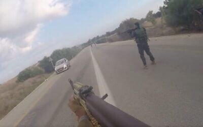 Screenshot of Hamas body cam footage as terrorists fire on an Israeli vehicle during the terror organization's October 7, 2023, attack in southern Israel, released by the IDF and GPO. (Screenshot)
