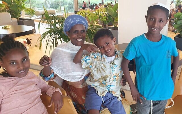 Anagu Walle, pictured with three of her children, from left, Mrte, Ermes and Yohanis, at the Nir Etzion Resort, northern Israel, October 15, 2023. (Courtesy, Embet Chekol, Jewish Agency)