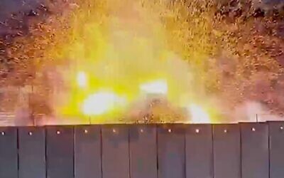 Screenshot of a Hamas video said to show an explosion blowing up part of the Israel-Gaza border fence on October 7, 2023 (via X)