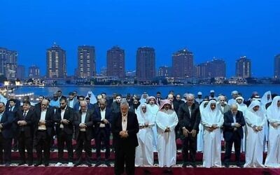 FILE - Hamas leader Ismail Haniyeh and other Hamas leaders leading a prayer before hosting an Iftar Ramadan fast-breaking dinner in Qatar with Qatari officials and international diplomats, April 13, 2023. (Hamas.ps)
