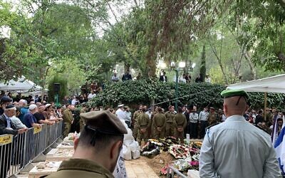 Hundreds of Israelis mourn the death of the 20-year-old Corporal Netanel Young at his funeral on Monday evening, October 9, 2023. (Charlie Summers/Times of Israel)