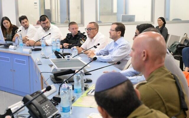 President Isaac Herzog (center right) at a Netivot council meeting, October 17, 2023 (Amos Ben Gershom / GPO) President Isaac Herzog (center right) at a Netivot council meeting, October 17, 2023 (Amos Ben Gershom / GPO)